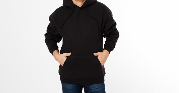 Heather black hoodie on man in jeans, isolated, with copy space, mock up