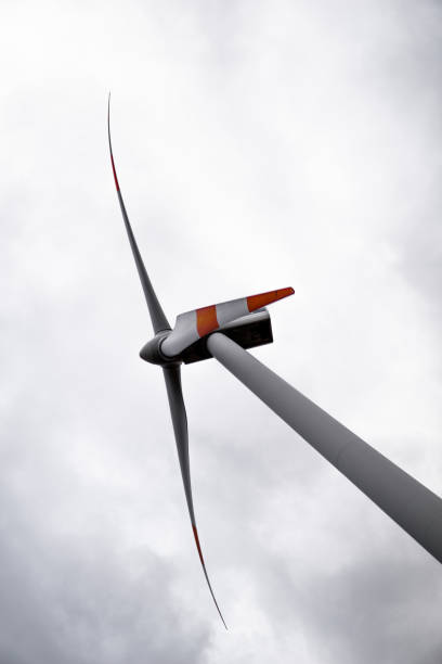 istock wind turbine in the sky 1355697923