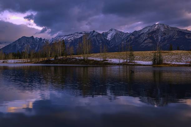 istock Moody Clouds Over Quarry Lake 1355698382