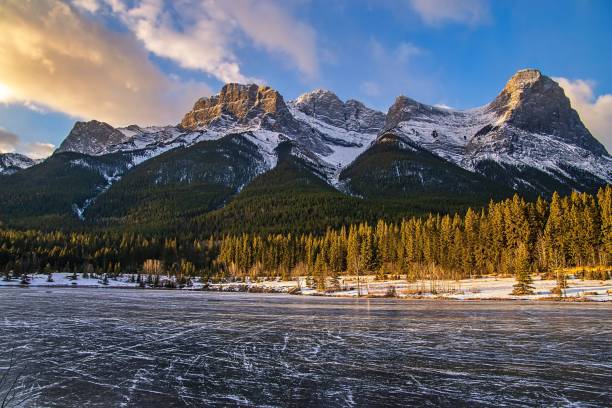 istock Sunlit Clouds Over A Frozen Quarry Lake 1355700099