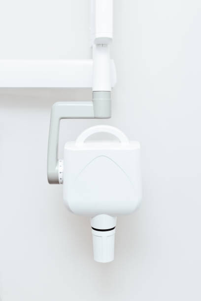 istock white dental x-ray machine on wall background 1355703627