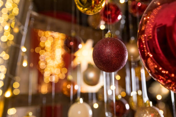 istock New Year Tree Art Installation Made with String Lights and Christmas Balls Hanging on Threads.Merry Christmas Happy New Year.Hanging colorful christmas decoration 1355705372