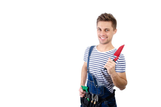 istock Housework and renovation. Young handsome handyman. 1355706715