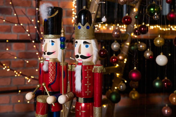 istock Traditional Christmas bauble decorations and creative christmas tree. Classic nutcracker toy. Merry Christmas and New Year holiday composition, festive concept. Festive composition for the holiday season. 1355707011