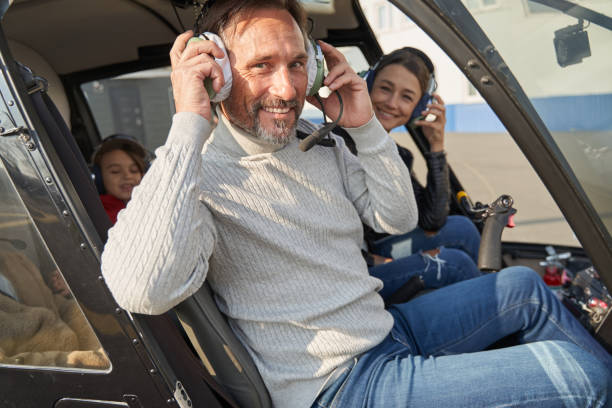 istock Excited amateur pilot preparing to fly a helicopter 1355710027