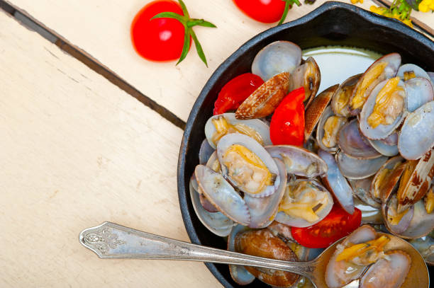 istock fresh clams on an iron skillet 1355710244