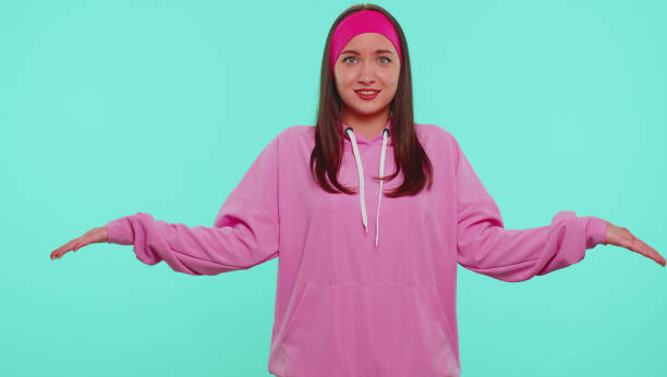 istock Girl raising hands in indignant expression asking why what reason of failure demonstrating disbelief 1355714524
