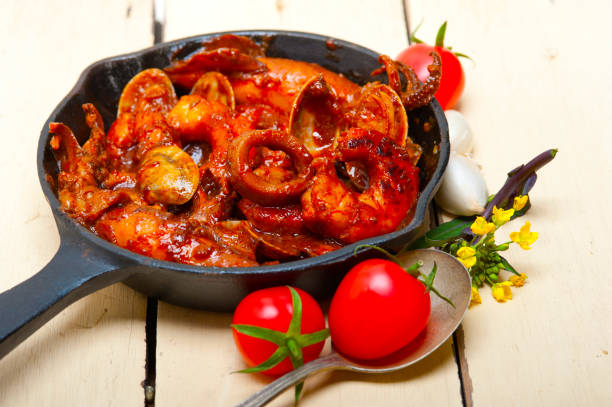 istock fresh seafoos stew on an iron skillet 1355717501