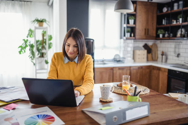 istock Freelance woman working in home office with laptop computer. Flexible workspace and working time. 1355720893