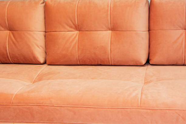 istock soft sofa of bright pink color, close-up, design. 1355721884