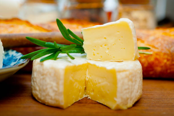 istock French cheese and fresh  baguette on a wood cutter 1355721996