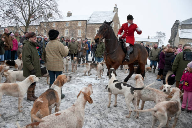 Masham, North Yorkshire, England, United Kingdom - December 27, 2010: A fox hunt meeting on a snowy Boxing Day in the Market Place, Masham