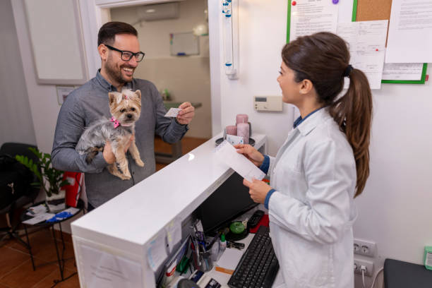 istock A man bringing his pet to the veterinary practice 1355725927
