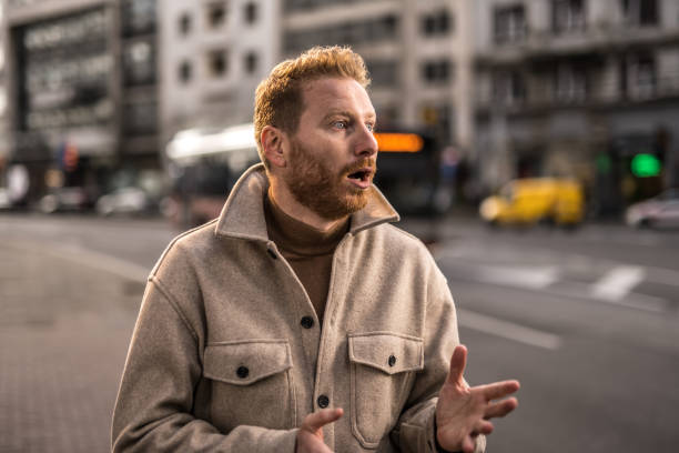 istock Shocked young man in the city. 1355732825