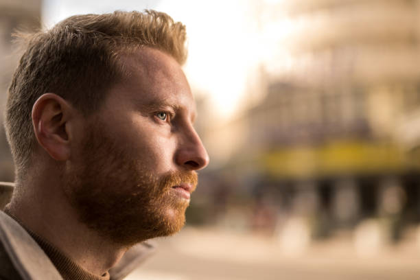 istock Serious young man in the city. 1355732839