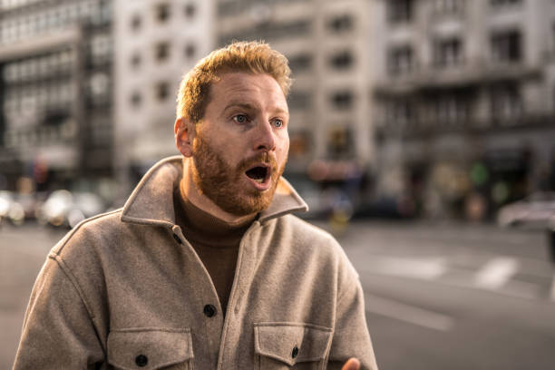 Shocked young man in the city.