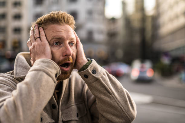 istock Shocked young man in the city. 1355732885