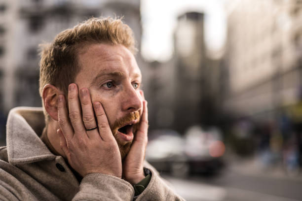 istock Shocked young man in the city. 1355732930