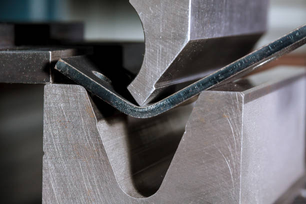 istock The process of bending metal parts on a modern bending machine. 1355733410