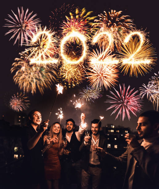 istock friends celebrate the christmas on the rooftop 1355735765