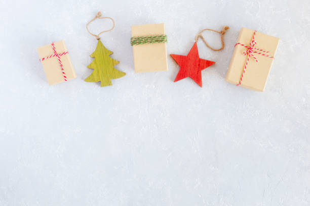 istock Christmas flat lay composition of gift boxes and wood decoration 1355736669