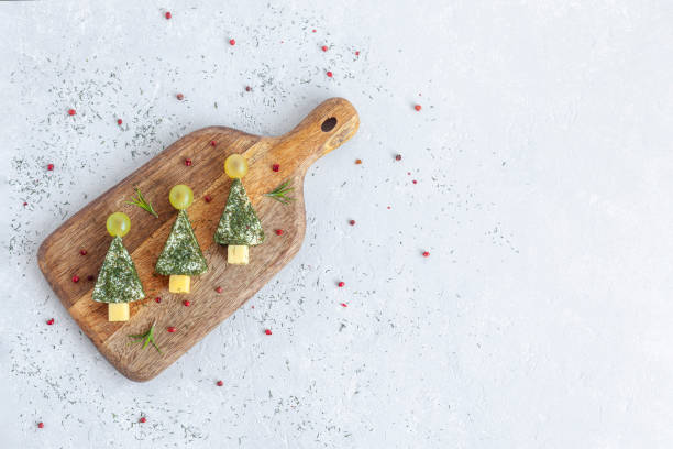 istock New year trees appetizer made of cheese, top view 1355737509