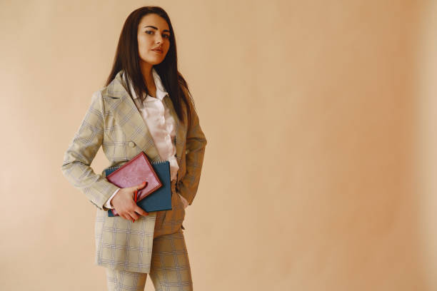 istock Woman standing on a brown background 1355747326