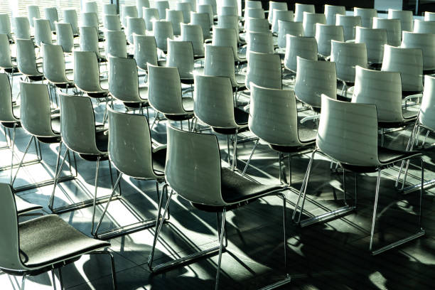 istock White chairs in conference room 1355766590