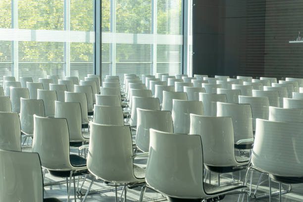 istock White chairs in conference room 1355766624