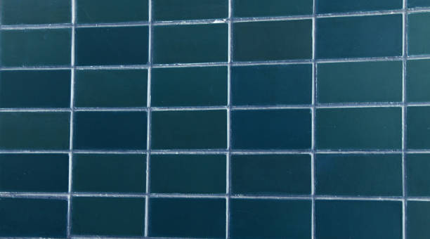 istock background of dark blue rectangular ceramic tiles. blue tile in shape of a rectangle. background of regular tiles without ornament. photograph of old simple soviet tiles in modern style. 1355769358
