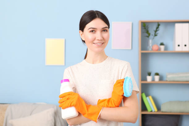 istock Young housewife is doing house cleaning close-up 1355772965