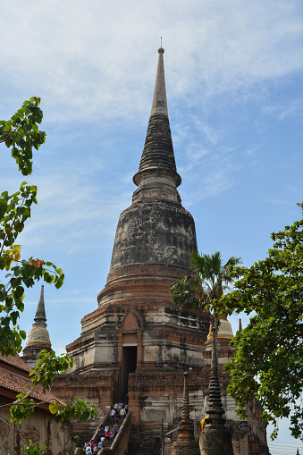Ayutthaya, Thailand. Close-up pagoda of Wat Yai Chai Mongkol an elegant and beautiful sculpture with clear blue sky.