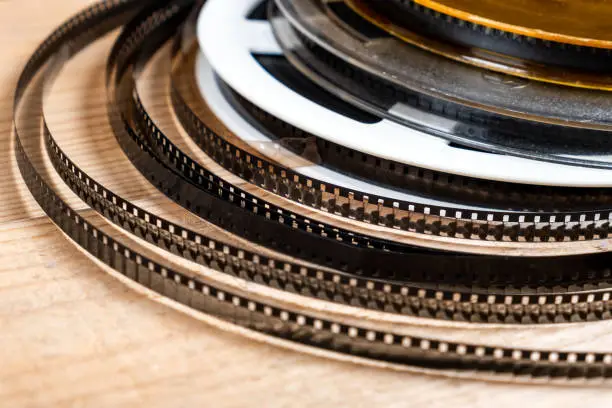 Old Film Reels on the Wooden Planks Background closeup