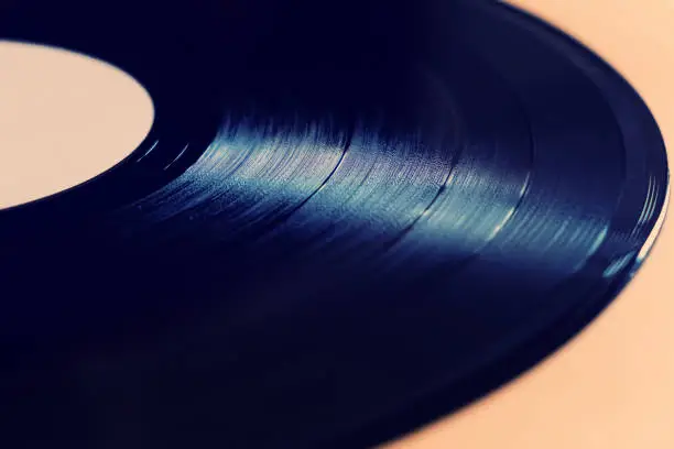 Toned Photo of Old Vinyl Record on the Table closeup