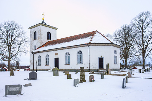 Ullene, Sweden -Febrary 15, 2021: Country church with snow in winter