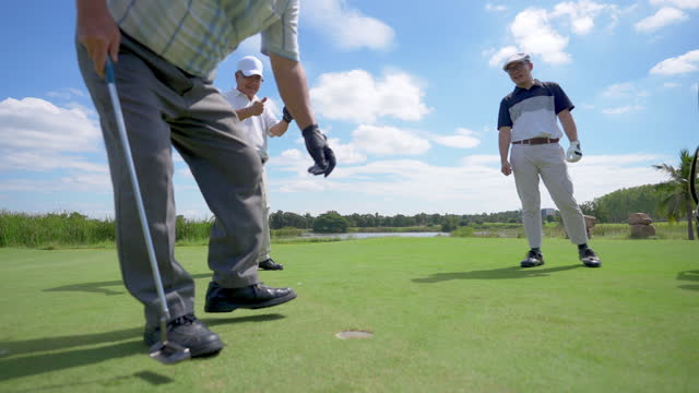 4K Group of Asian people golfer golfing together at country club.
