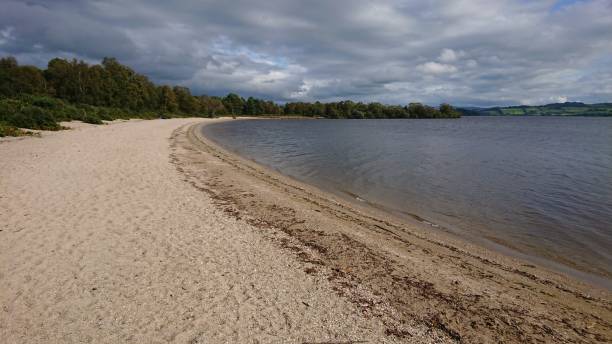 istock Sandy Bay On Lock Lomond Island 1355790131