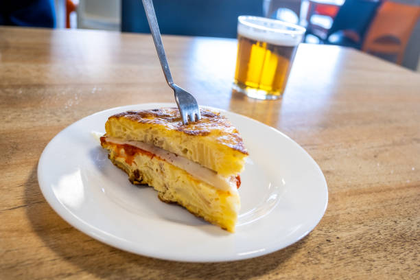 Pincho de tortilla with a beer, a typical Spanish appetizer stock photo