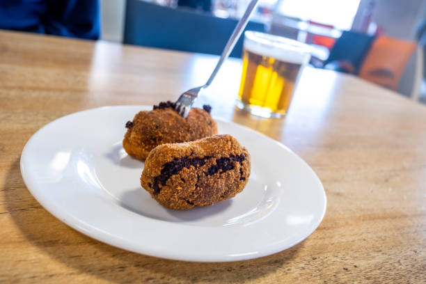 Homemade croquettes with a beer, typical Spanish appetizer stock photo