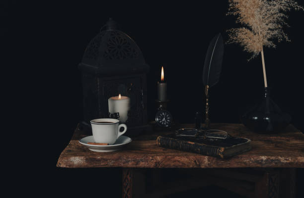 Fortune telling on coffee grounds by candlelight. stock photo