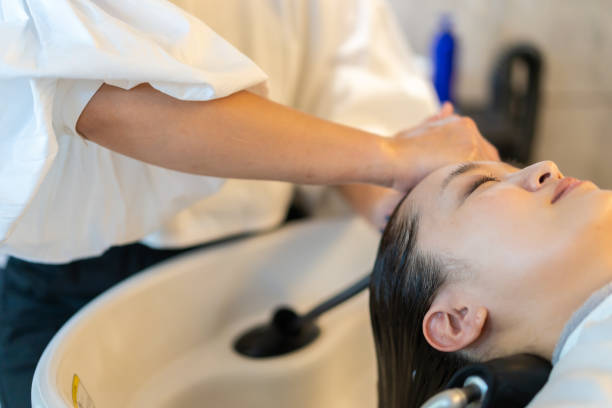 istock A hairdresser shampooing a customer 1355798549