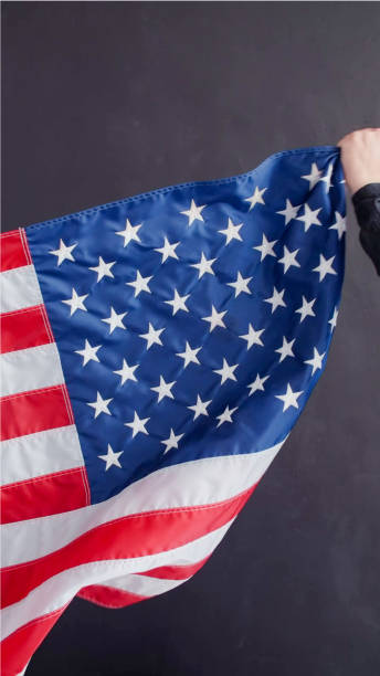 istock Closeup of American flag on plain background 1355800826