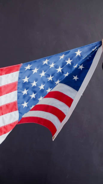 istock Closeup of American flag on plain background 1355800827