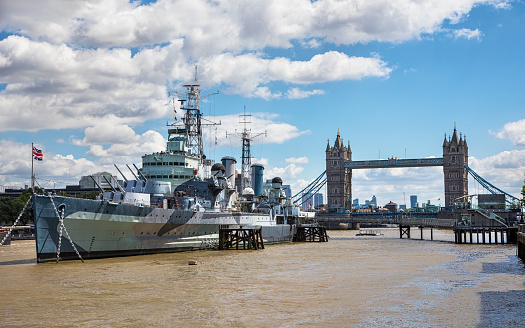 The former warship HMS Belfast moored near Tower Bridge in London: it is now part of the Imperial War Museum.