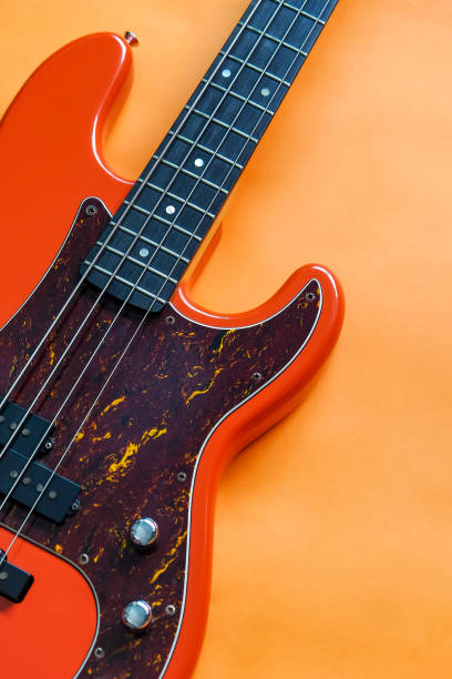 istock orange electric bass guitar 1355802768