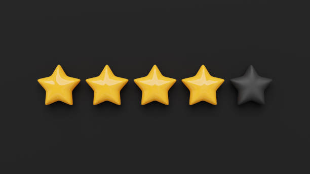 istock Glossy yellow five star rating on a black background. 3D rendered image. 1355802829