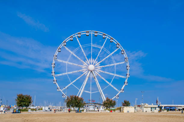 Rimini, Beach & Ferris Wheel (Emilia-Romagna, Italy) Beach of Rimini with the ferris wheel in background rimini stock pictures, royalty-free photos & images