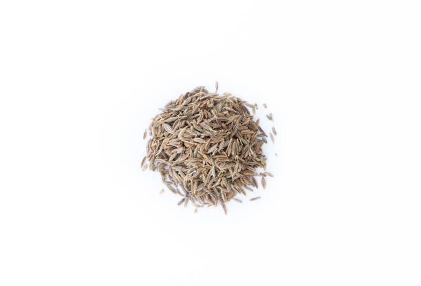 Seeds of cumin, caraway on white background