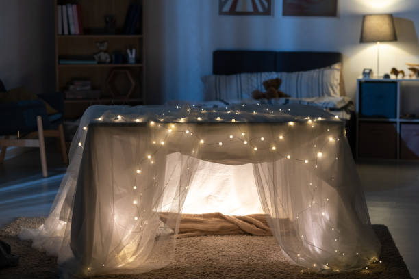 istock Cozy Handmade Play Tent In Dark Nursery 1355807222
