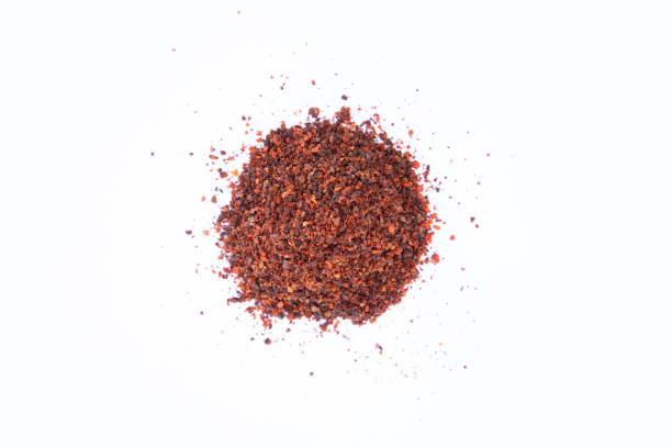 istock Red powdered pepper isolated on white background. 1355807350
